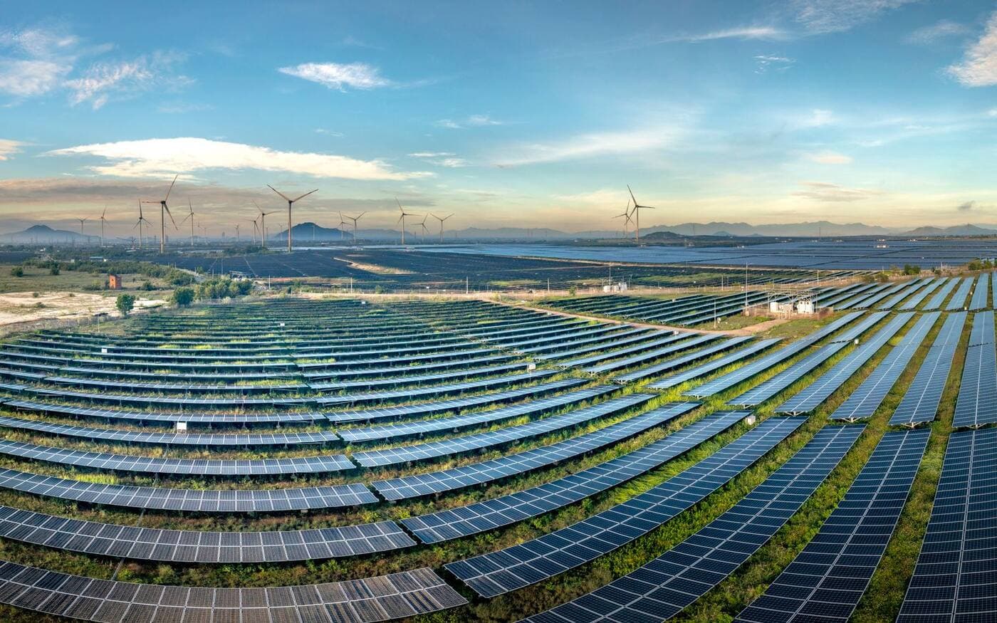 Solar panels and wind turbines generating clean energy